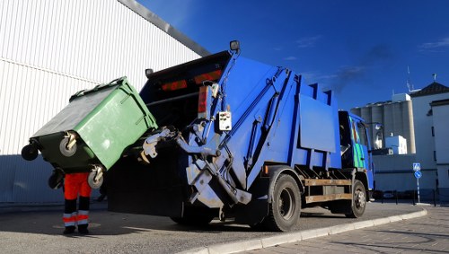 Low-carbon electric waste collection van on local road